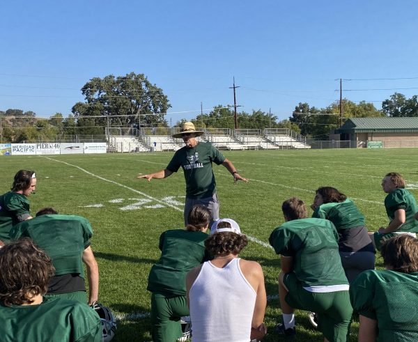 Coach Don Crow hands out