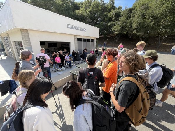 Crowd watching haircut