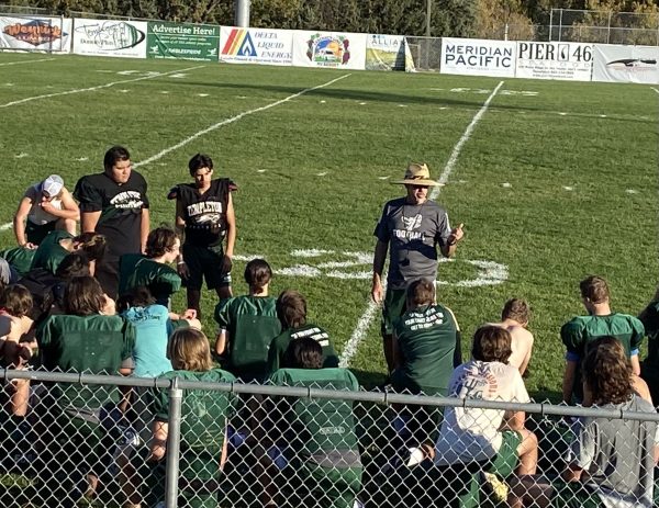 Don Crow talking to team